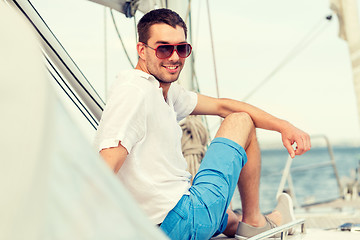 Image showing man sitting on yacht deck