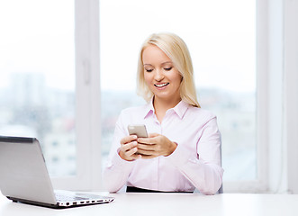 Image showing smiling businesswoman or student with smartphone