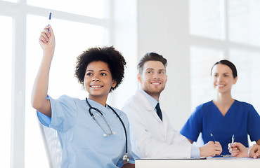 Image showing group of happy doctors on conference at hospital