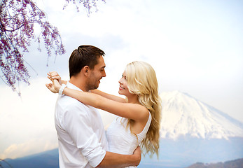 Image showing happy couple hugging  over fuji mountain in japan