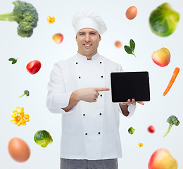 Image showing happy male chef cook showing with tablet pc