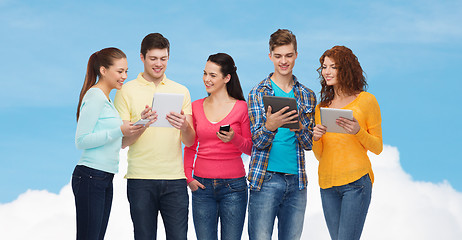 Image showing group of teenagers with smartphones and tablet pc
