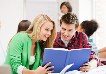 Image showing students reading book at school