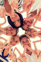 Image showing smiling friends in circle