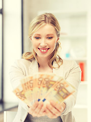 Image showing lovely woman with euro cash money