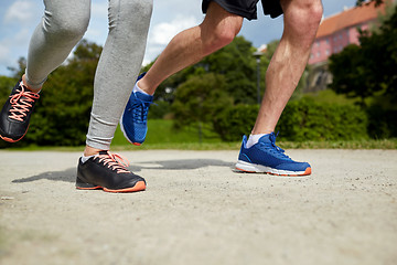 Image showing close up of couple running outdoors