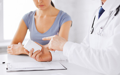 Image showing patient and doctor prescribing medication