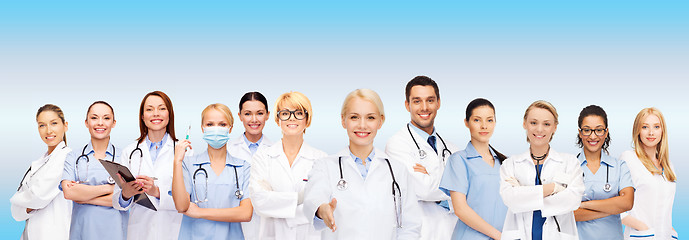 Image showing smiling female doctors and nurses with stethoscope