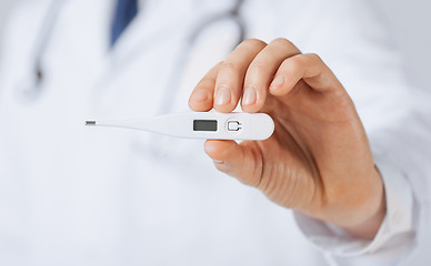 Image showing male doctor with thermometer