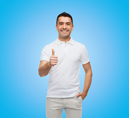 Image showing smiling man showing thumbs up