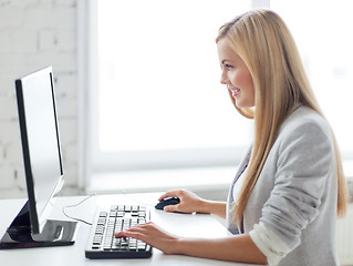 Image showing businesswoman with computer in office