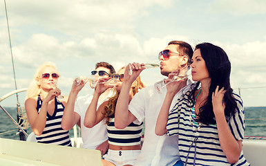 Image showing smiling friends with glasses of champagne on yacht