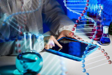 Image showing close up of scientist with tablet pc in laboratory