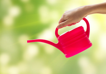 Image showing close up of woman hand holding watering can