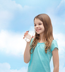 Image showing smiling little girl with glass of water