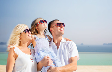 Image showing happy family  over summer beach background