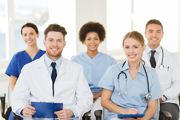 Image showing group of happy doctors on seminar at hospital