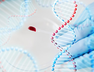 Image showing close up of scientist with blood sample in lab