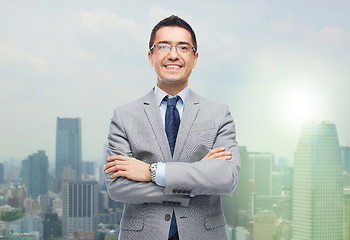 Image showing happy smiling businessman in eyeglasses and suit