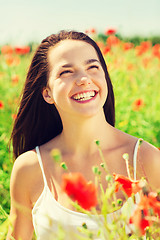 Image showing laughing young woman on poppy field