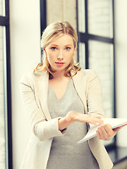 Image showing worried woman with documents