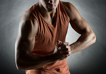 Image showing young man showing biceps