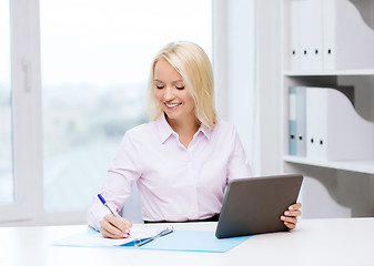 Image showing smiling businesswoman or student with tablet pc