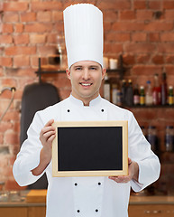 Image showing happy male chef cook holding blank menu board