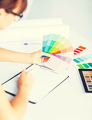 Image showing woman working with color samples for selection