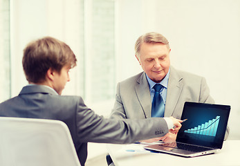 Image showing older man and young man with laptop computer