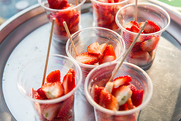 Image showing strawberry in plastic cups at street market