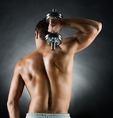 Image showing young man with dumbbell