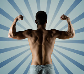 Image showing young man or bodybuilder showing biceps