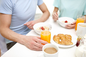 Image showing close up of couple having breakfast at home