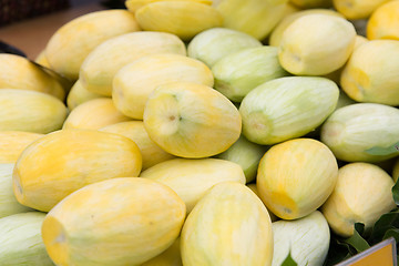 Image showing peeled mango at street market