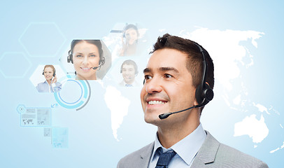 Image showing smiling businessman in headset