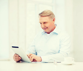 Image showing old man with tablet pc computer at home