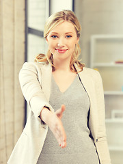 Image showing woman with an open hand ready for handshake