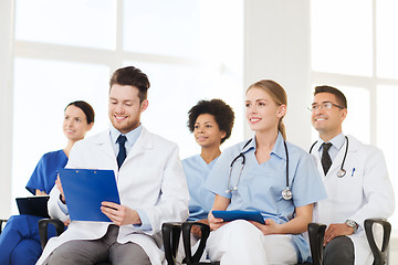 Image showing group of happy doctors on seminar at hospital