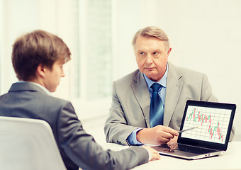 Image showing older man and young man with laptop computer