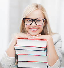 Image showing student with stack of books