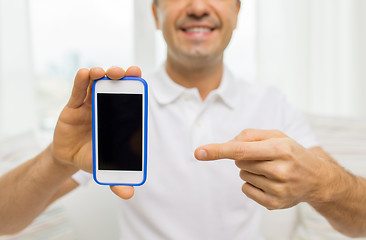 Image showing close up of happy man with smartphone at home
