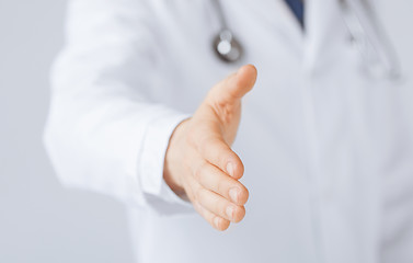 Image showing male doctor with open hand ready for hugging