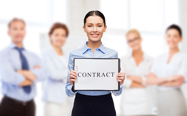 Image showing smiling businesswoman with contract