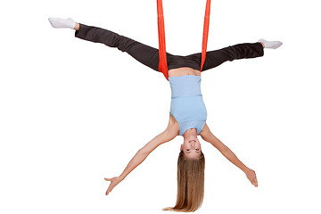 Image showing Young woman making antigravity yoga exercises in stretching twine