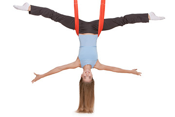 Image showing Young woman making antigravity yoga exercises in stretching twine