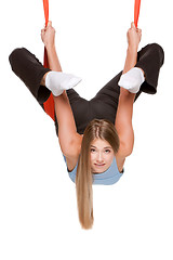 Image showing Young woman doing anti-gravity aerial yoga