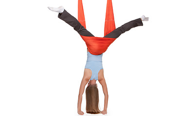 Image showing Young woman making antigravity yoga exercises in stretching twine