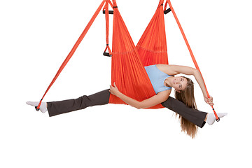 Image showing Young woman making antigravity yoga exercises in stretching twine