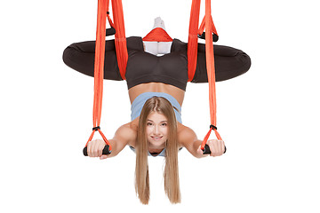 Image showing Young woman making antigravity yoga exercises in stretching twine